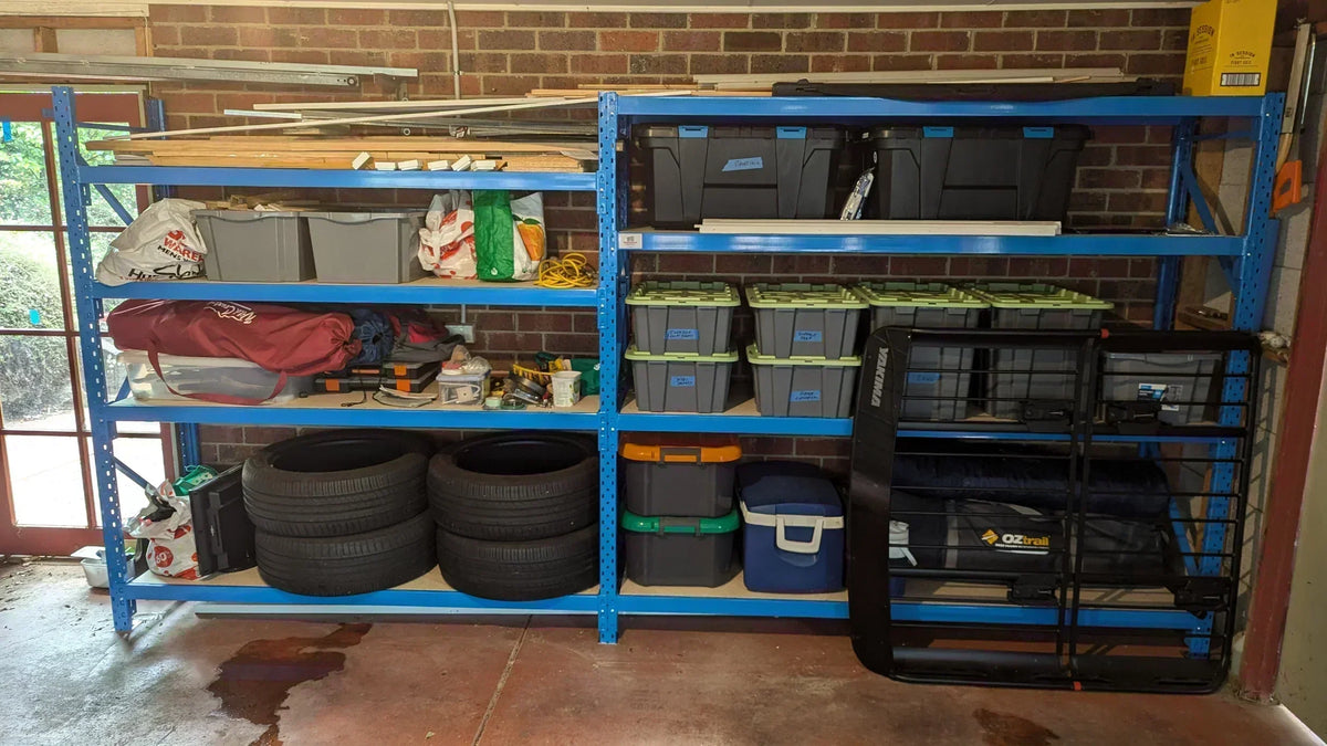 Longspan Garage Shelving with tyres, tubs and random equipment for storage