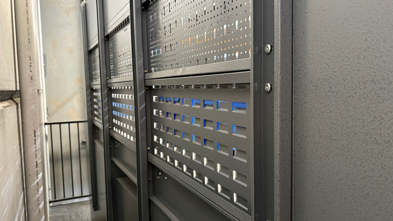 Back of the unit of a Modular garage storage system with workbench, and shelves on with no side cabinets